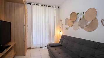 Apartamento | Zona de estar | Una televisión de pantalla plana