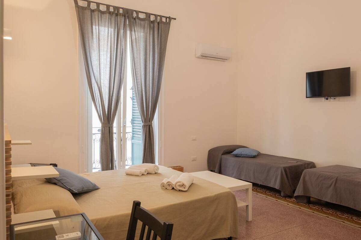 Deluxe Quadruple Room | Hypo-allergenic bedding available, down comforters, minibar (free items)