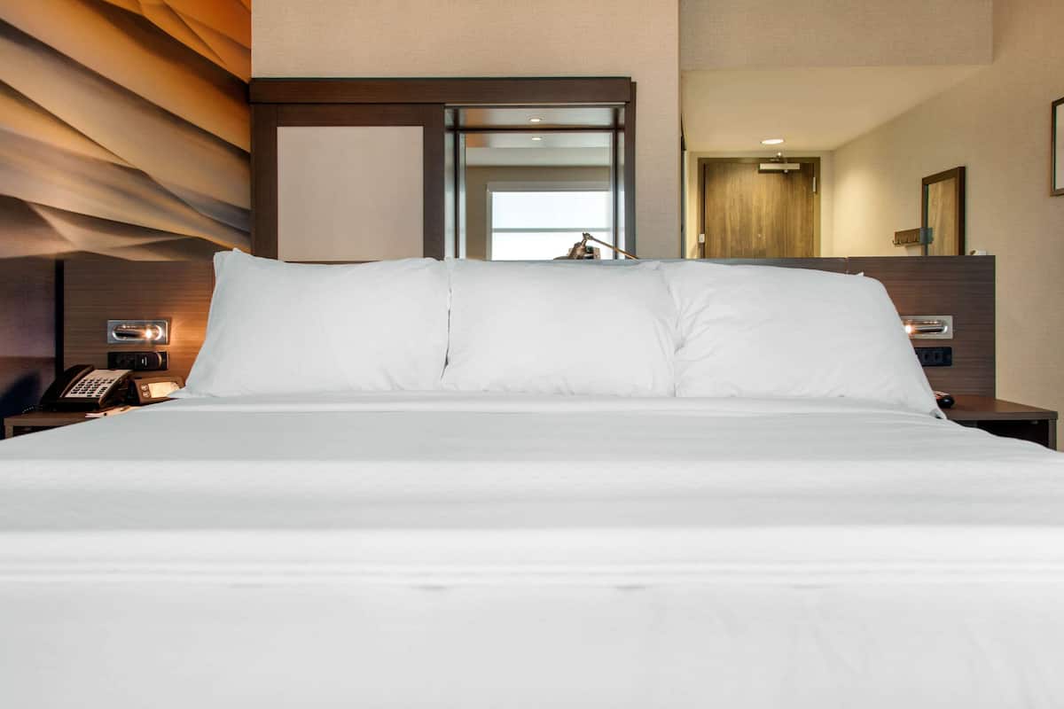 premium bedding, desk, laptop workspace, blackout curtains