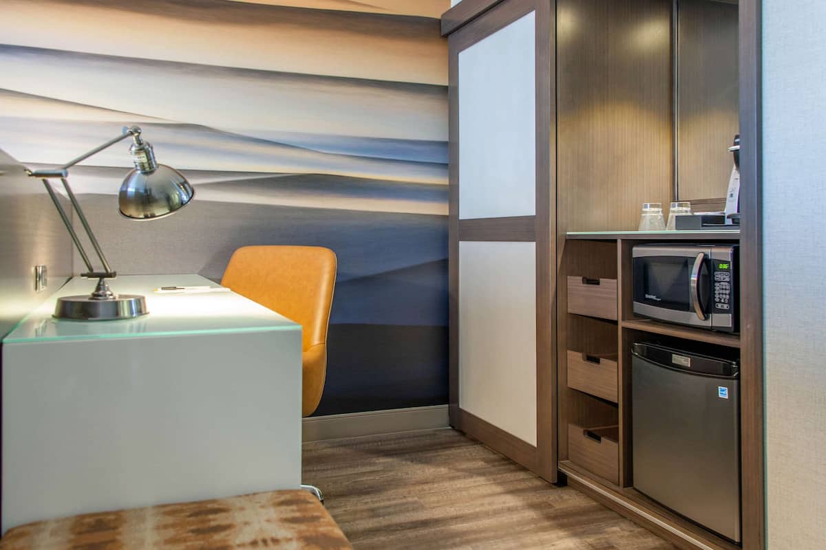 premium bedding, desk, laptop workspace, blackout curtains