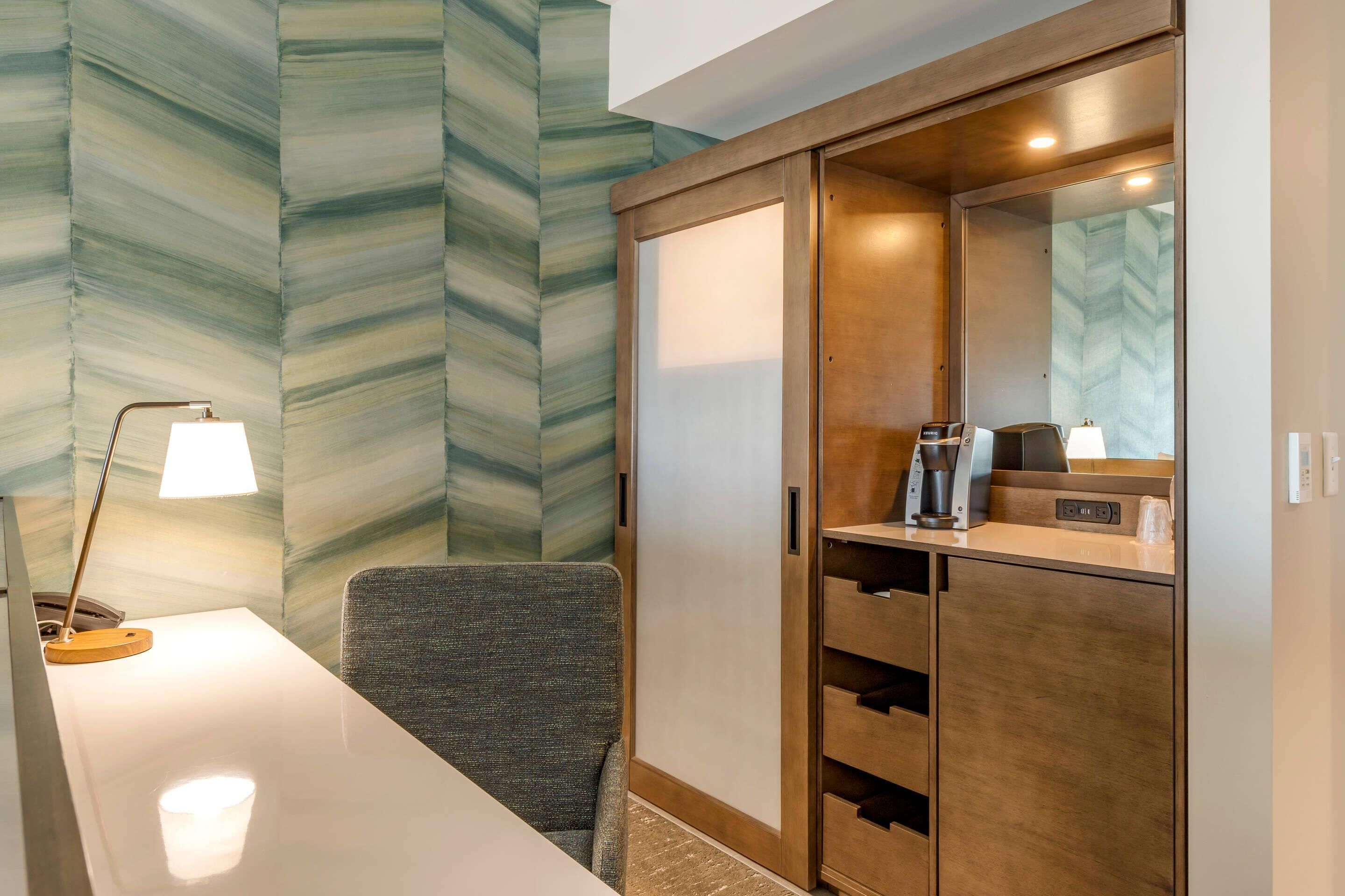 Premium bedding, desk, laptop workspace, blackout drapes