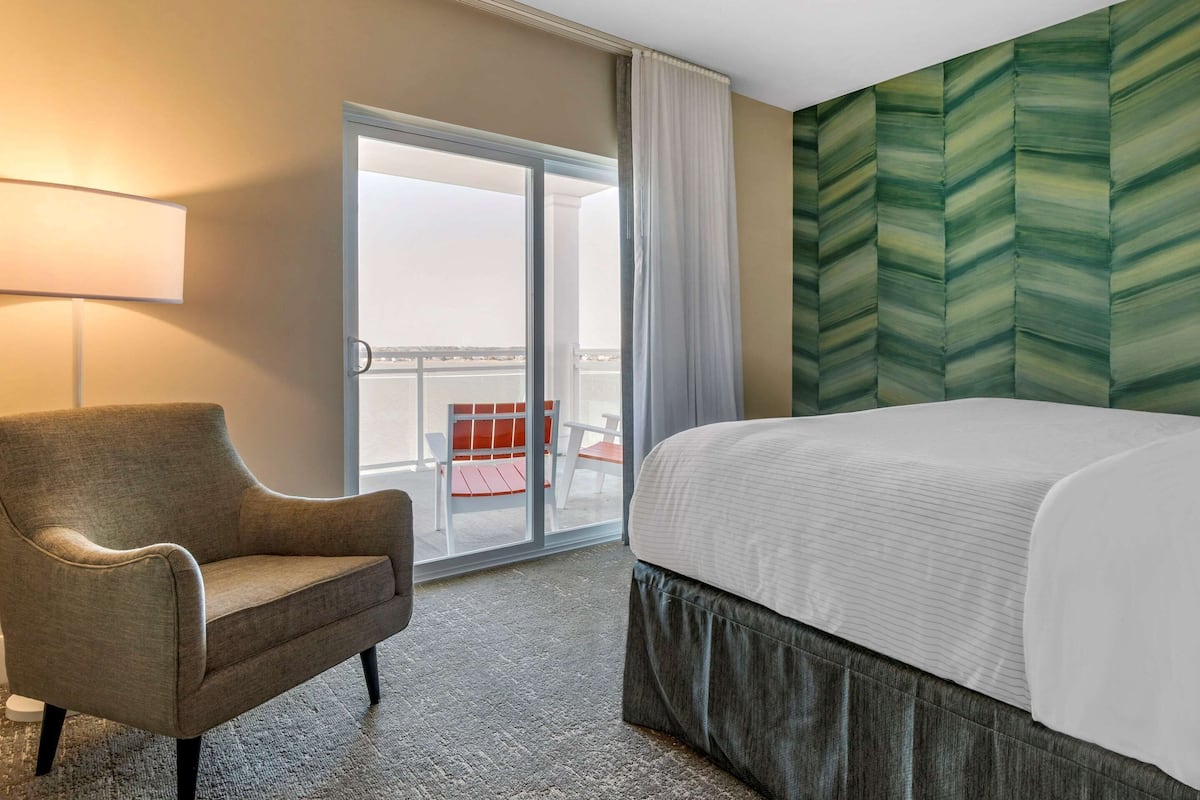 Premium bedding, desk, laptop workspace, blackout drapes