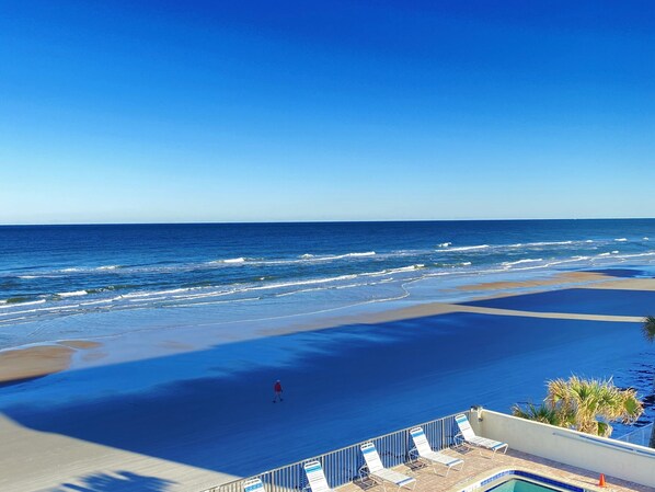 On the beach, sun loungers, beach towels