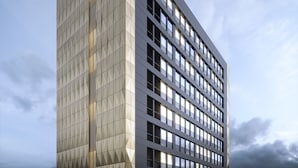 A modern high-rise building with a geometric facade and numerous windows. - Mercure Newport Hotel (Newport)