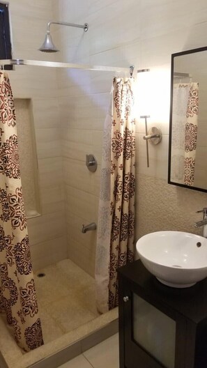 Shower, towels, soap, toilet paper