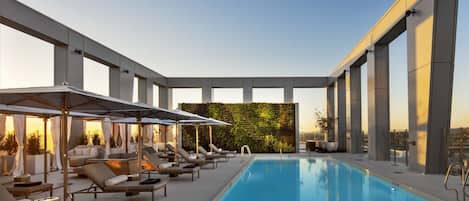 Outdoor pool, open 7:00 AM to 8:00 PM, cabanas (surcharge)