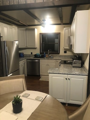 Microwave, dishwasher, coffee/tea maker, cookware/dishes/utensils