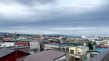 A cityscape with various buildings, including residential and commercial structures.