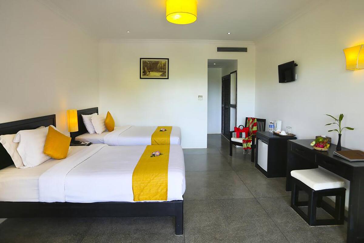 Deluxe Triple Room, 1 Bedroom, Pool View | Premium bedding, pillowtop beds, in-room safe, desk