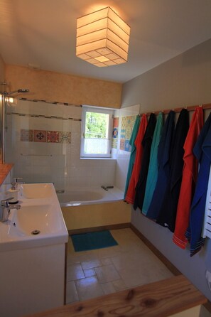 Bathtub, hair dryer, towels, soap