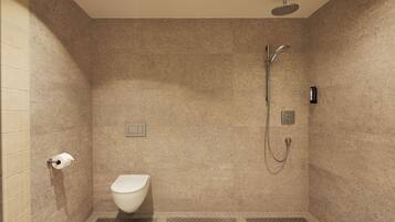 Un baño moderno con ducha, inodoro y un perchero para toallas.
