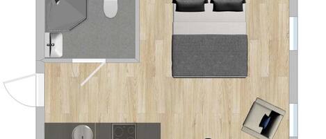 A bedroom with a bed, bedside tables, and a window.