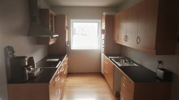 Apartment, 2 Bedrooms (D) | Private kitchen | Full-sized fridge, microwave, oven, stovetop