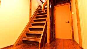 A wooden staircase leading to a door. - Nikko Guesthouse Sumica - Hostel (Nikko)