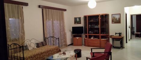 Apartment, 3 Bedrooms | Living area | Flat-screen TV