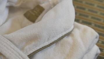 A white towel with a visible tag and a zipper.