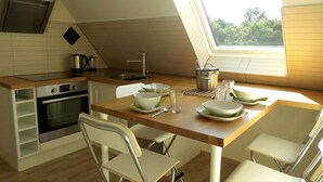 A compact kitchen with a dining area, featuring a stove, oven, and a skylight. - Exclusive & modern - right on the lake - spacious apartment with balcony (Wesenberg)