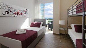 A hotel room with a bed, a bunk bed, a painting, a window, and a balcony. - SUNDAY - 3bed Villa walking distance to Ayia Napa Center (Ayia Napa)
