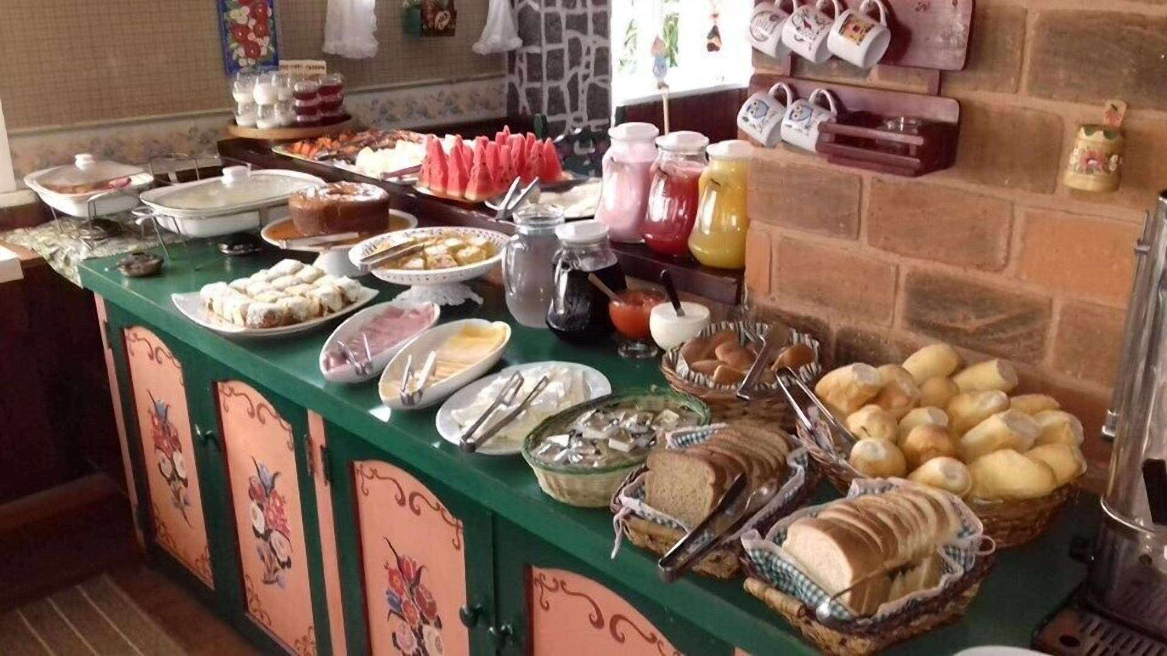 A buffet with various food items and beverages.