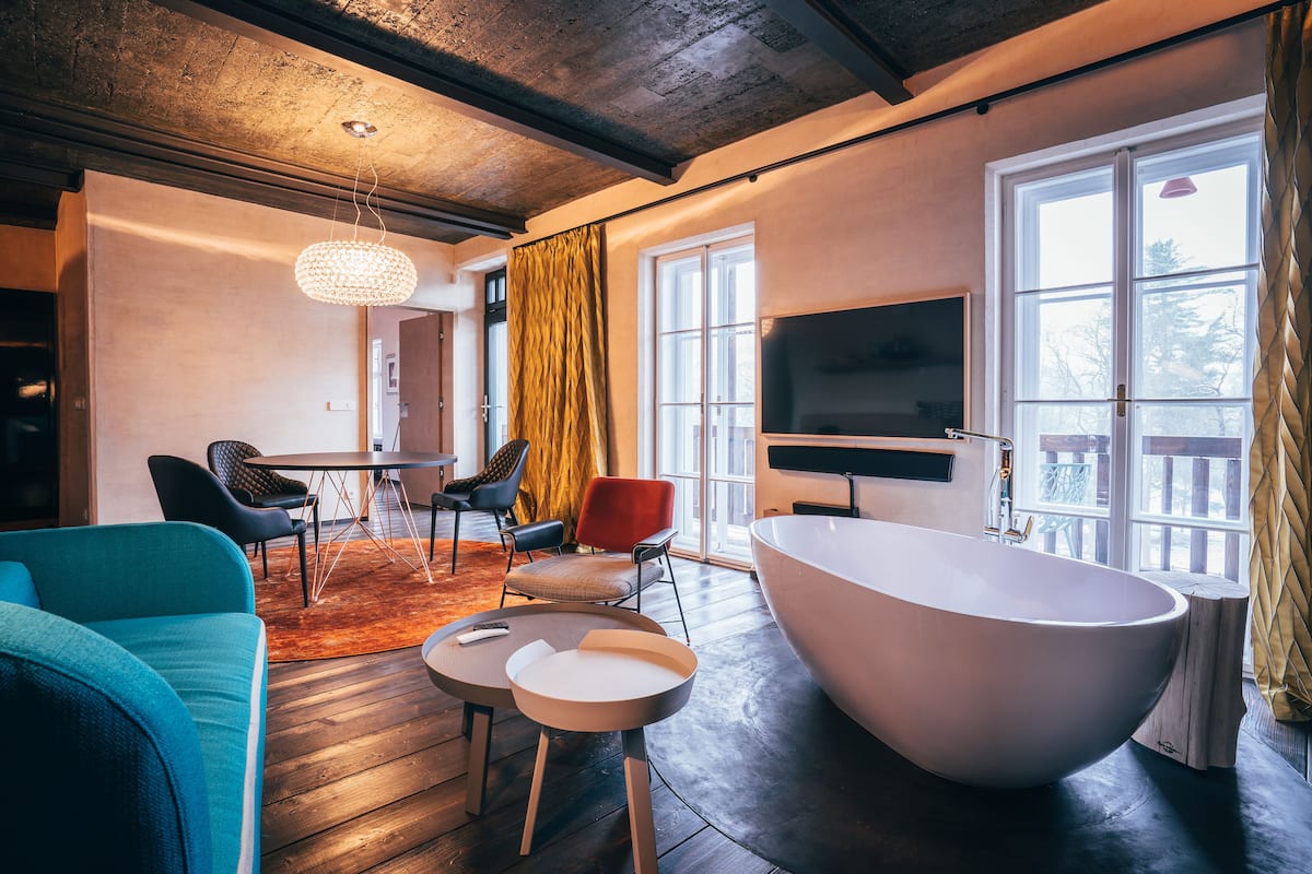 Deluxe Apartment, Balcony | Living room | 127-cm flat-screen TV with satellite channels, TV, fireplace