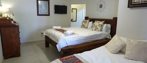 Family Room, Private Bathroom | Minibar, blackout curtains, iron/ironing board, free WiFi