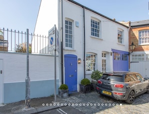 Traditional building with a controlled parking zone and a charming garden area.