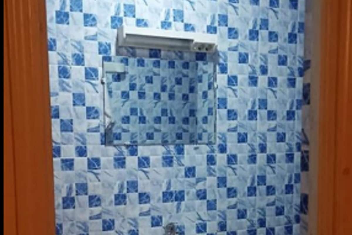 A bathroom with a sink and a shower.
