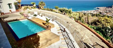 Seasonal outdoor pool, pool loungers