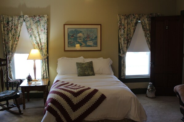A bedroom with a bed, a nightstand, a lamp, a chair, and a window with curtains. - Private Killington Area Inn all to Yourself! (Pittsfield)