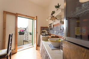 Fridge, coffee/tea maker, cookware/dishes/utensils