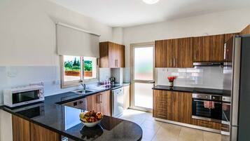 Villa, 3 Bedrooms | Private kitchen | Fridge, microwave, oven, dishwasher