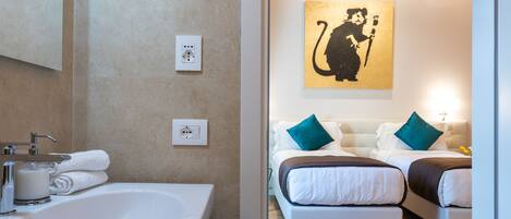 A modern bathroom with a large sink, mirror, and a wooden ceiling.
