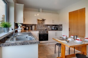 Fridge, microwave, oven, cookware/dishes/utensils