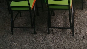 A conference room with green tables and chairs, arranged for a meeting. - Winner's Resort (Machakos)