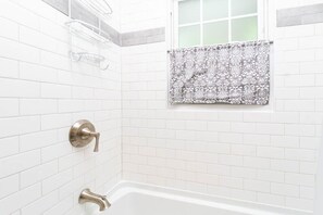 Combined shower/tub, hair dryer, towels, soap