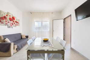 Standard Apartment, 1 Bedroom (Bilo A) | Living room | TV - Villa Poseidon (Porto Cesareo)