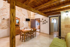 Standard House, 1 Bedroom | Living area | Flat-screen TV