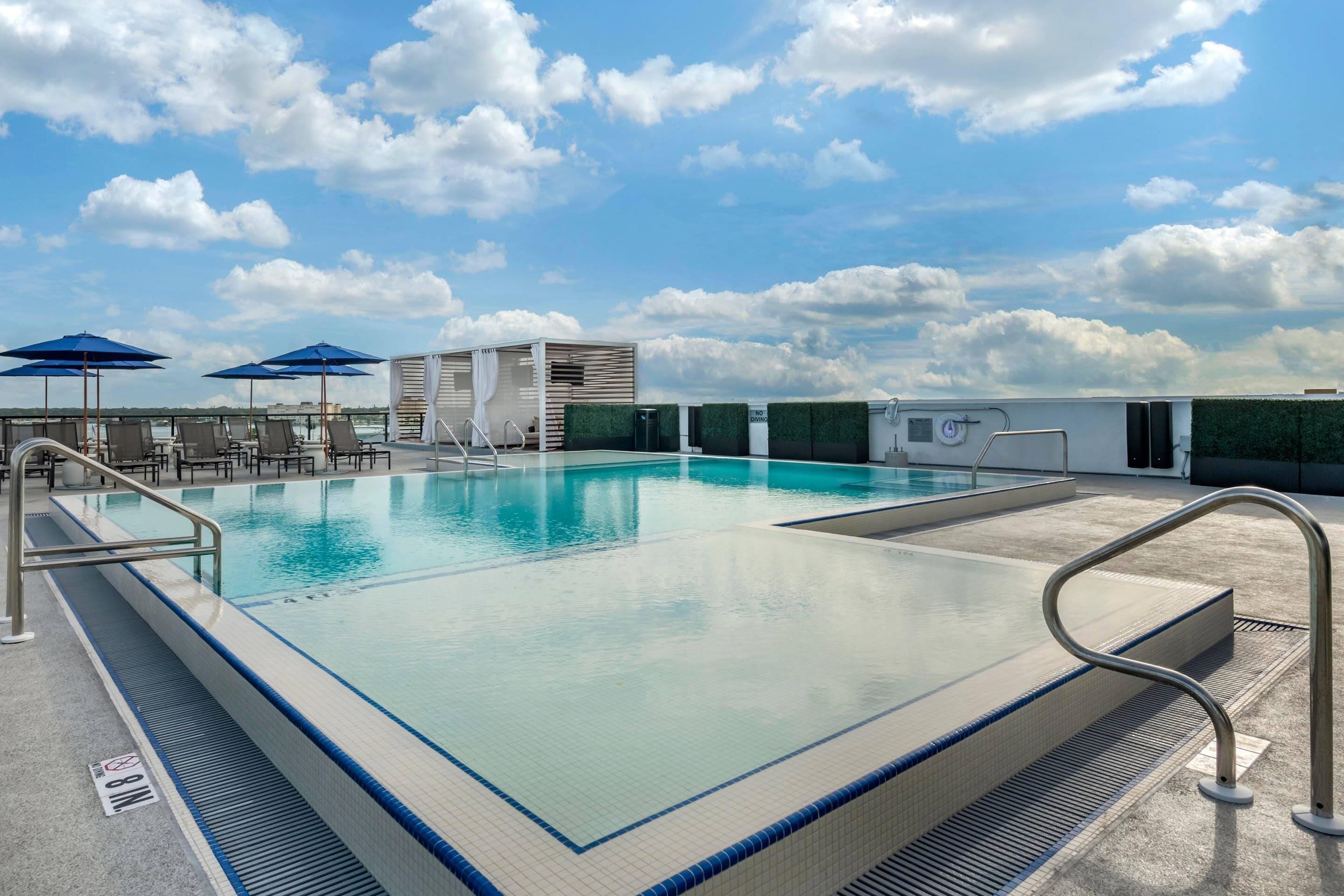 outdoor pool, pool umbrellas, pool loungers