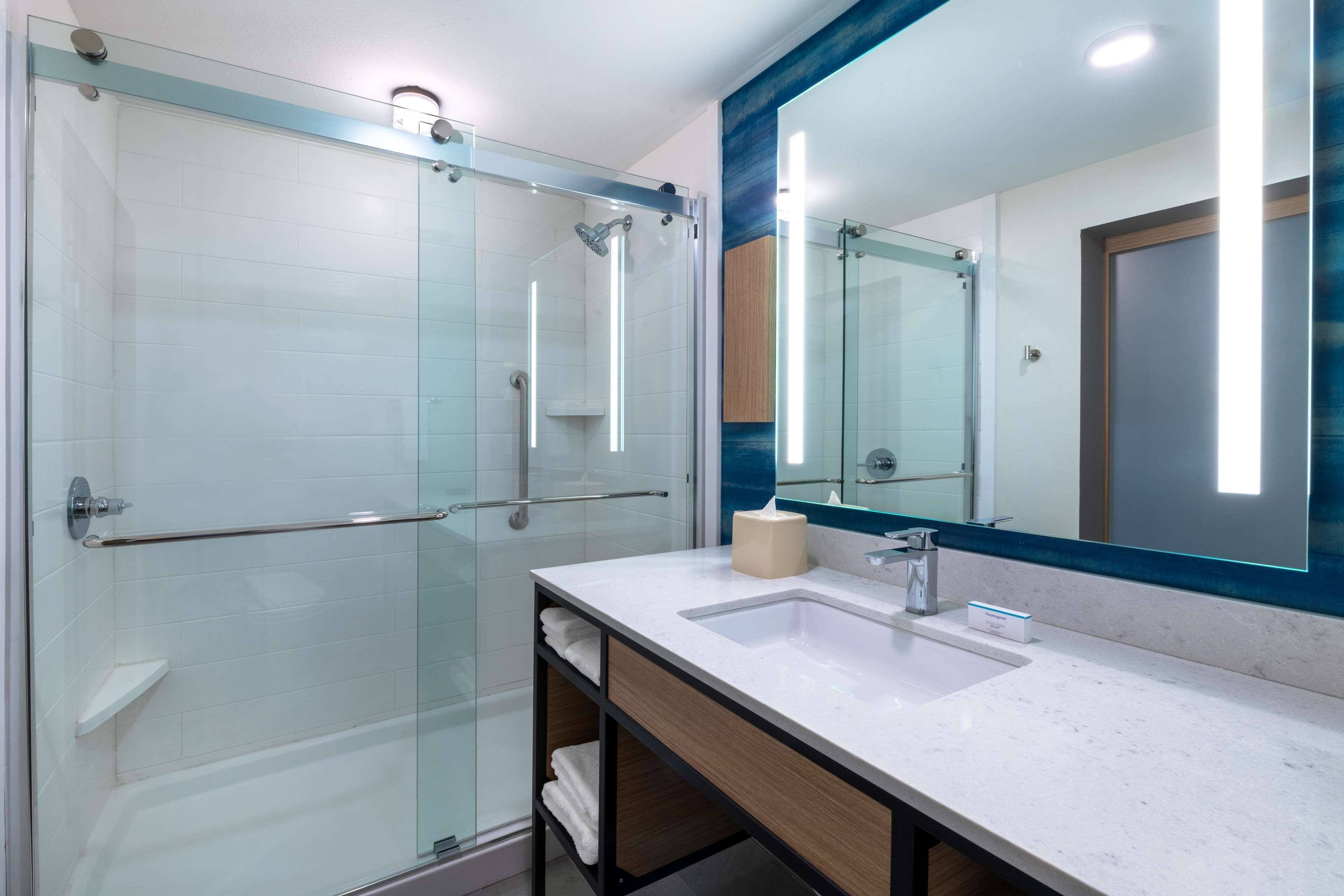 designer toiletries, hair dryer, towels, soap