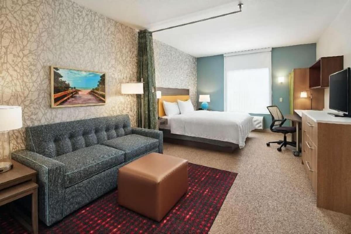 Desk, laptop workspace, blackout curtains, iron/ironing board