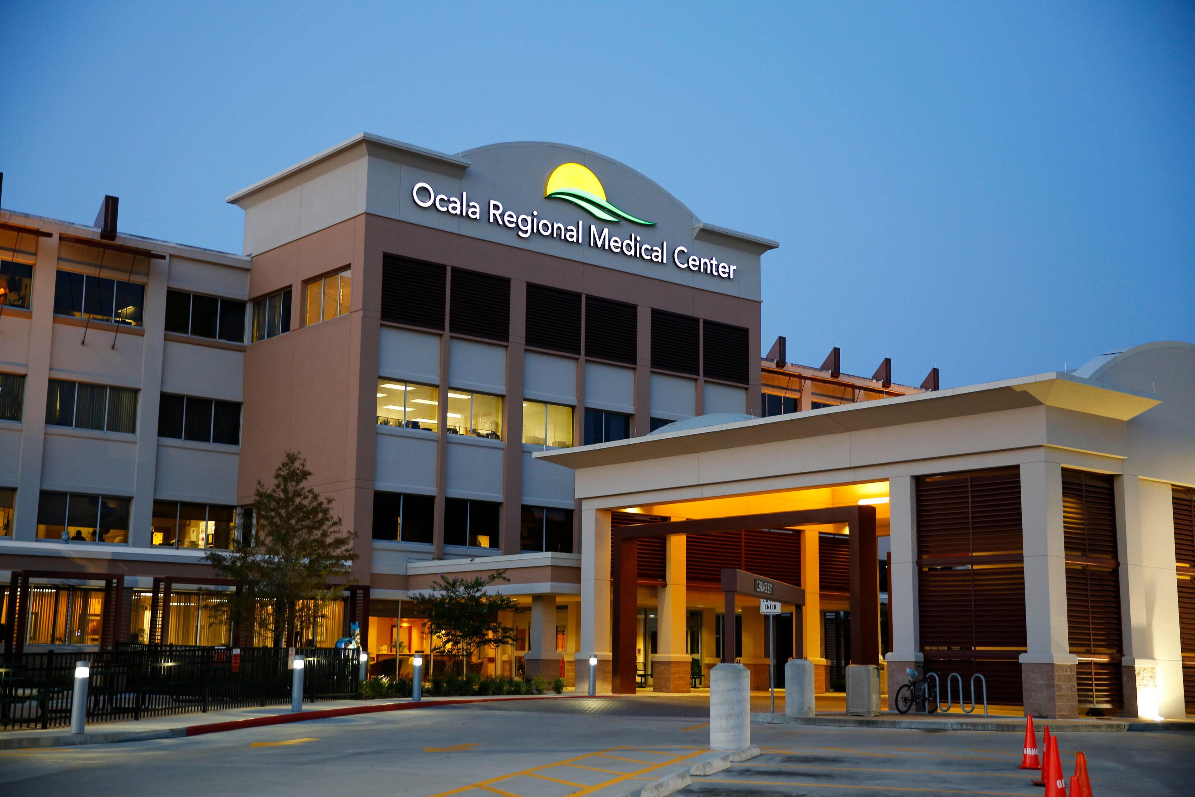 The exterior of Ocala Regional Medical Center with a clear entrance, a parking area, and a bicycle rack.