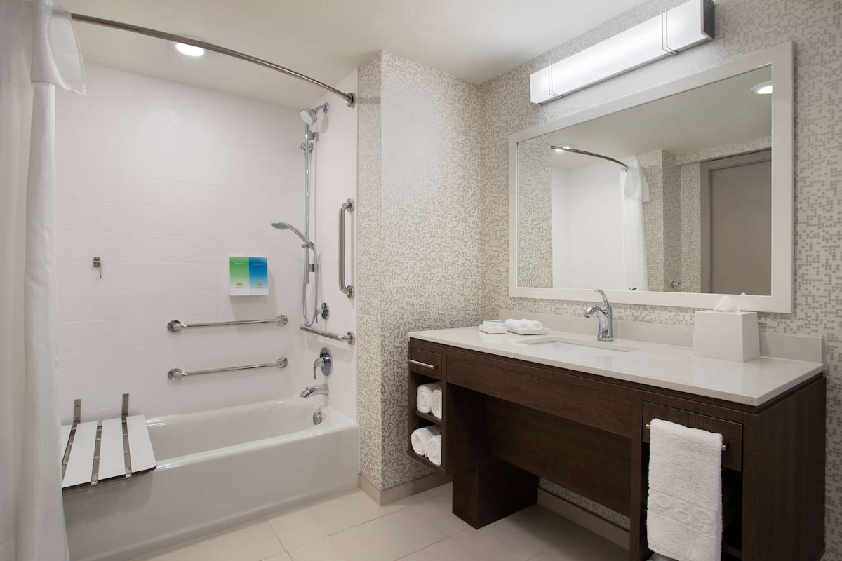 suite, 1 king bed, accessible, bathtub (mobility & hearing) | bathroom | eco-friendly toiletries, towels