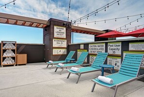 Outdoor pool, open 8:00 AM to 10:00 PM, sun loungers