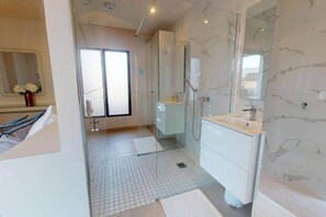 Shower, hair dryer, towels, toilet paper