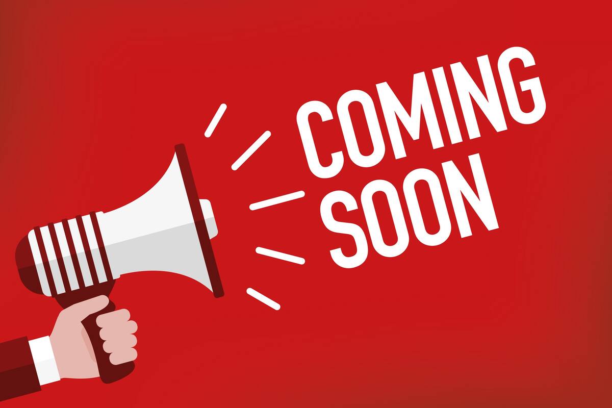 A hand holding a megaphone with the words "COMING SOON" on a red background.