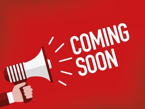 A hand holding a megaphone with the words "COMING SOON" on a red background.