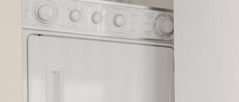 A white wall-mounted washer and dryer unit with control knobs and a door.