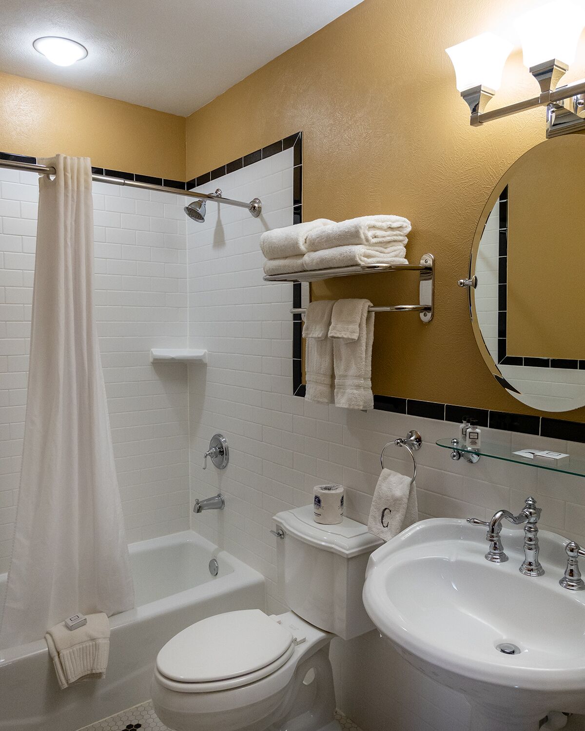 designer toiletries, hair dryer, towels