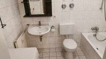 Bathtub, hair dryer, towels