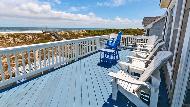 A deck with white and blue Adirondack chairs overlooking a beach. - OCEANFRONT, Ocean Views, Private Pool, Pool Table, Dogs Welcome, OS7Q, Dune Nothin (Corolla)